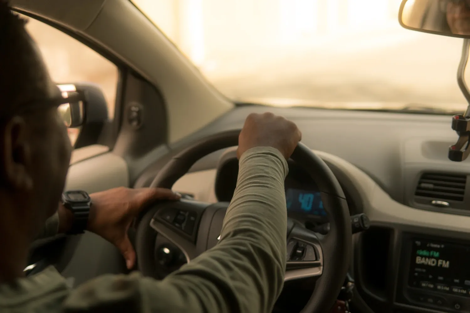 Man driving a car.