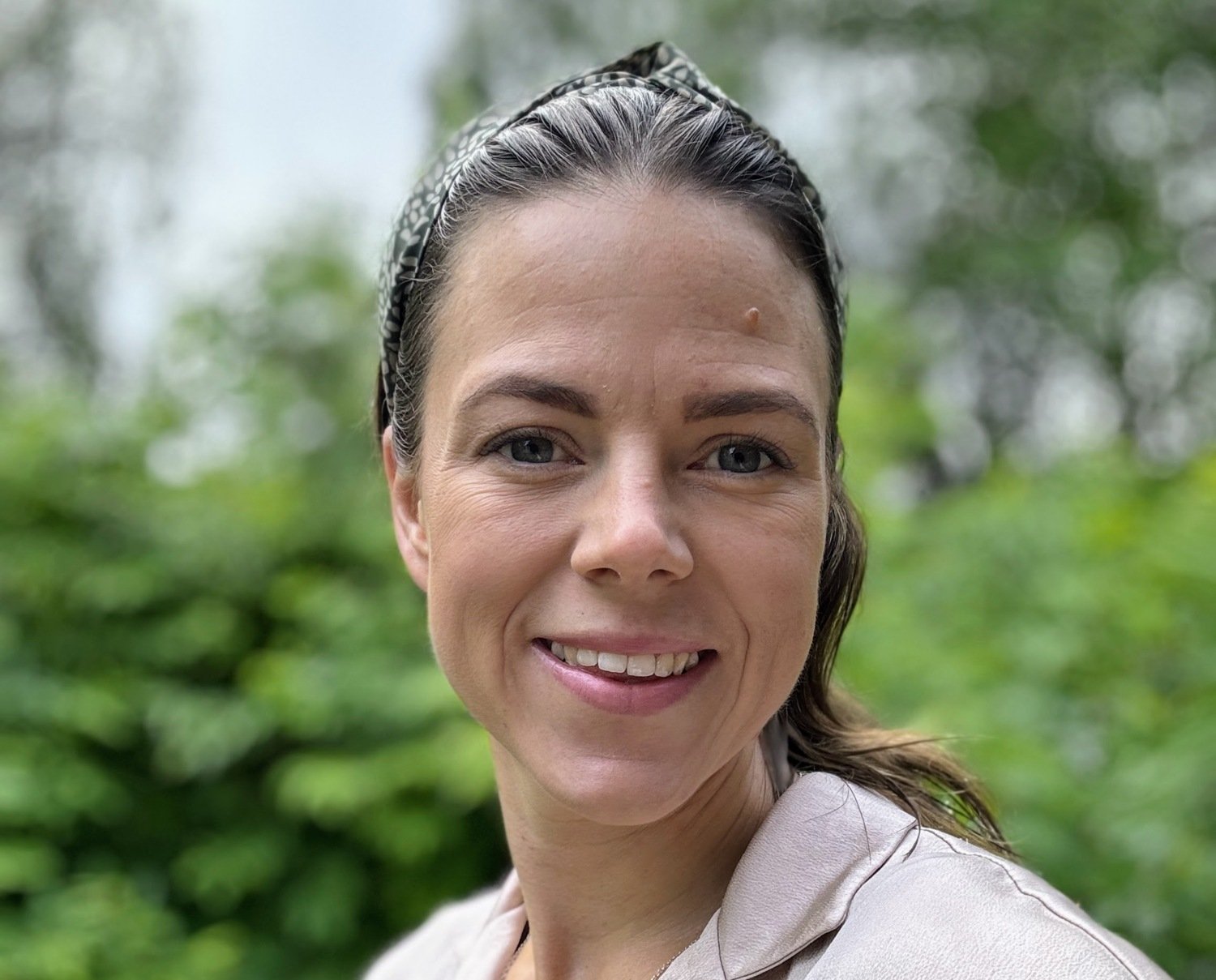 Woman in white jacket outside