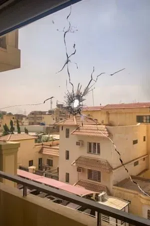 Window with a bullet hole in the glas