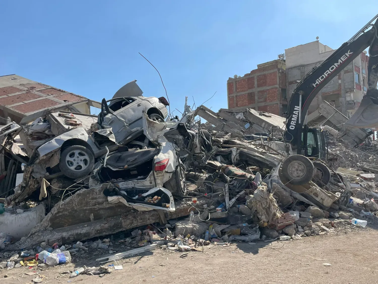 Destroyed houses and a car on a street
