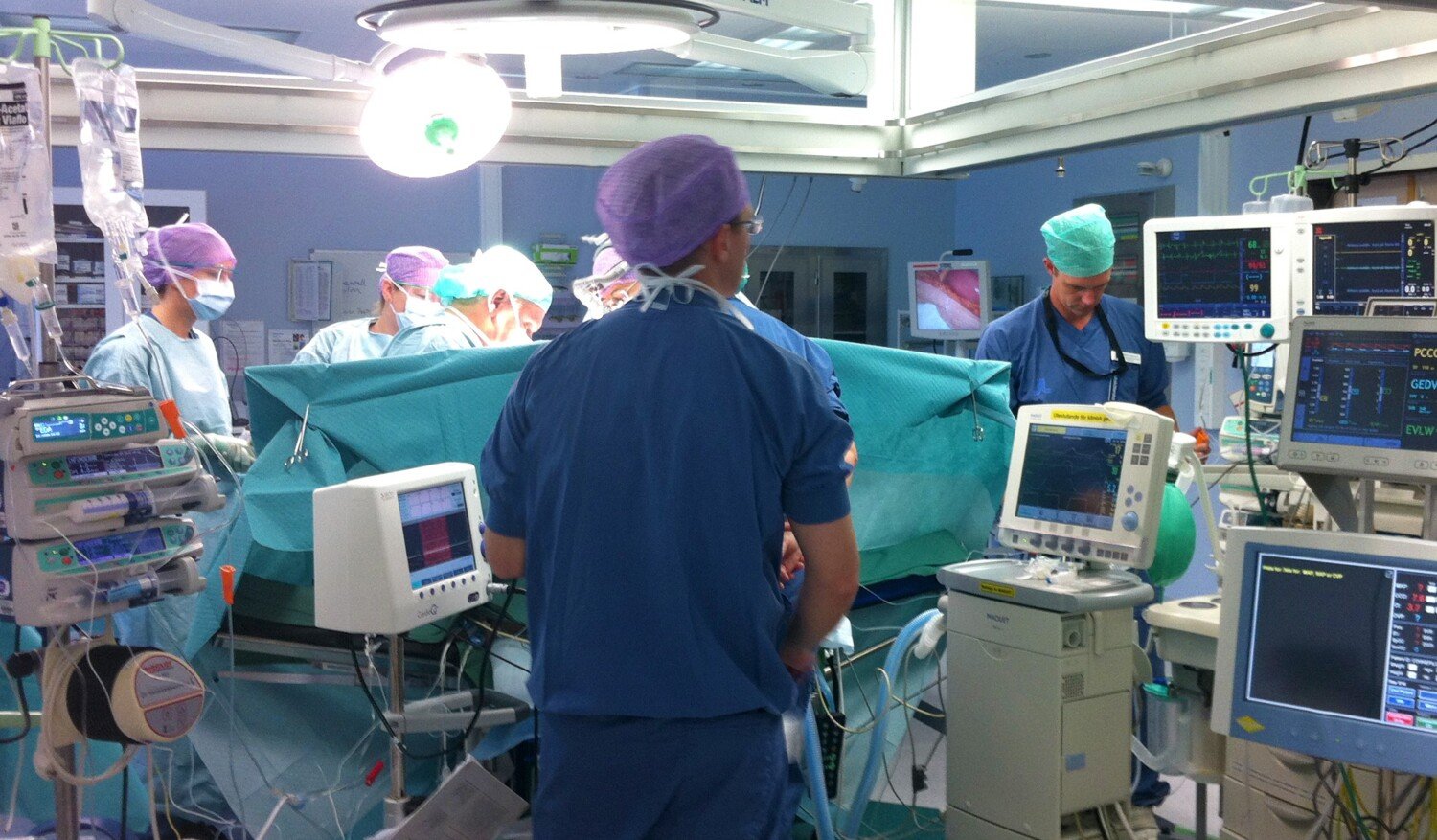 surgical procedure with nurses and surgeons.