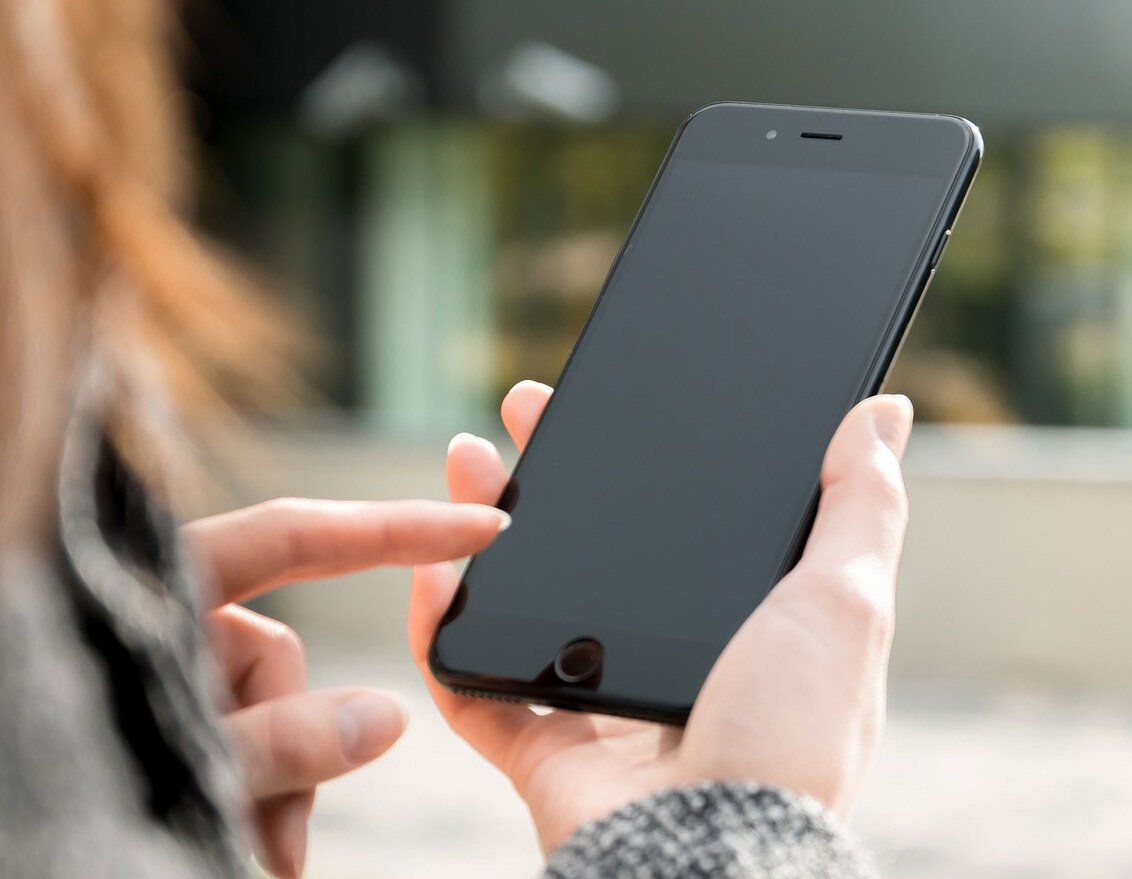 Hands holding a mobile phone