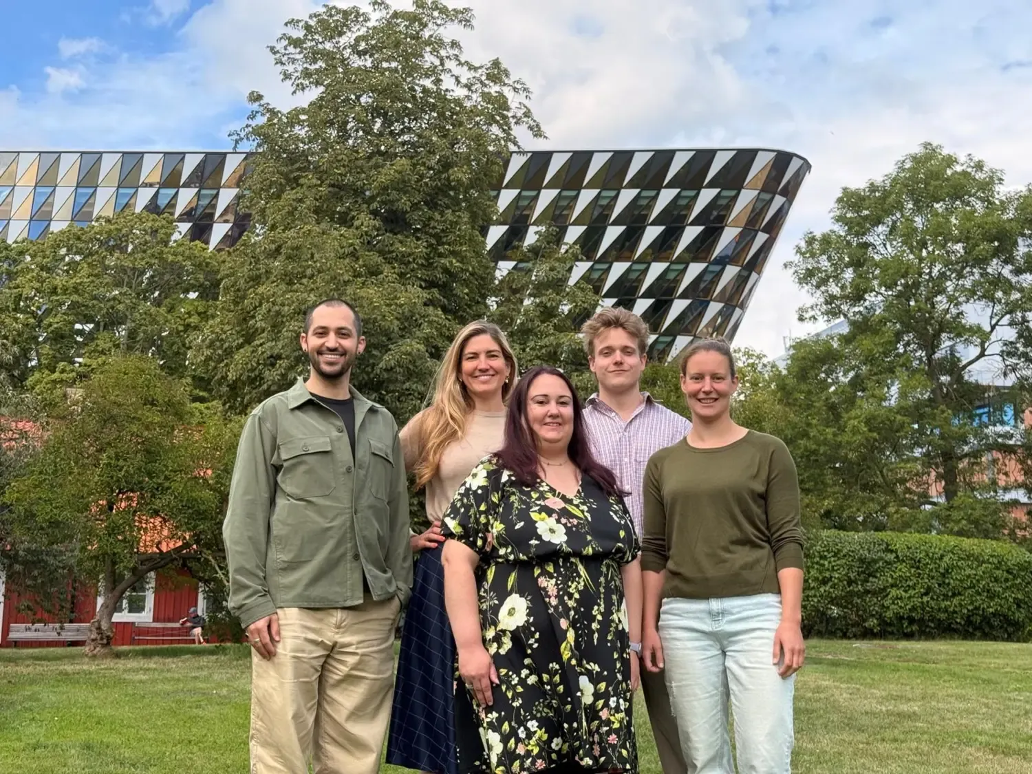 Group outside smiling for group photo.