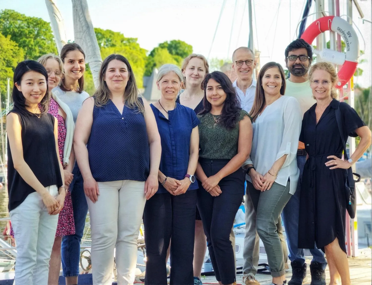 Group photo of ten people outdoors.