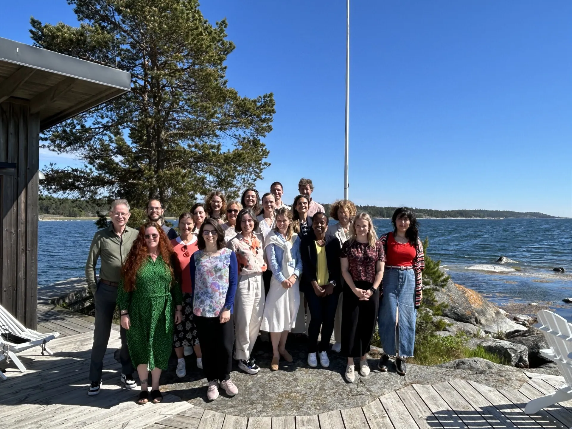 Group photo in an archipelago setting.
