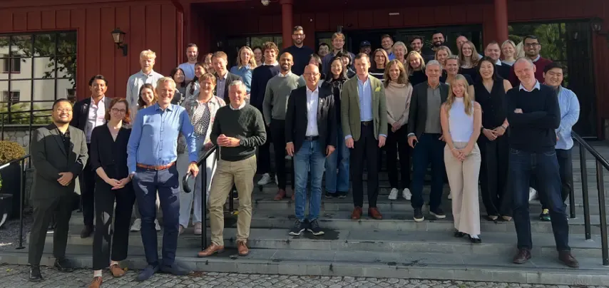 The researchers in Henrik Grönberg's group are depicted standing outside on a staircase.