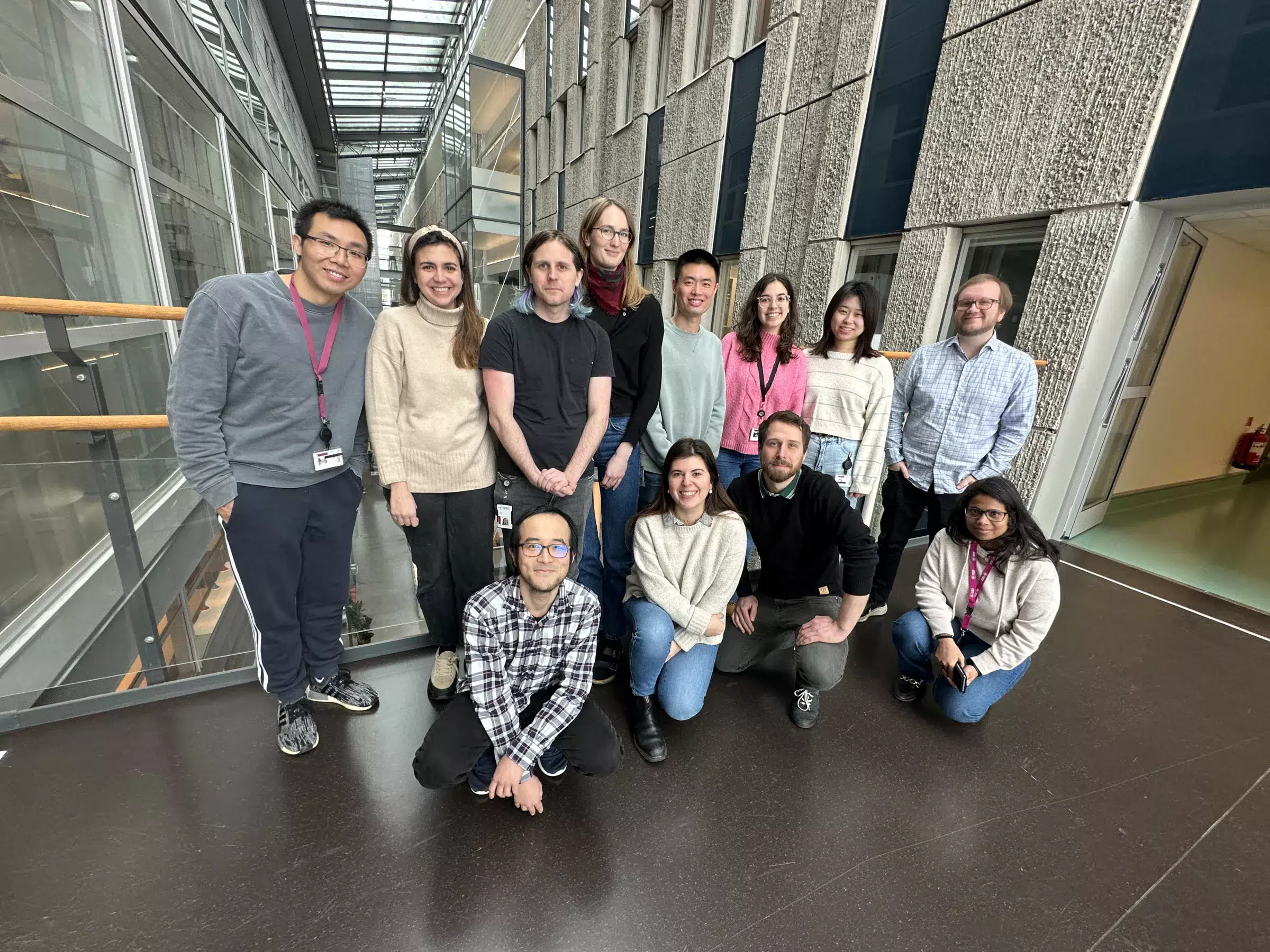 A group of people sitting and standing up together.