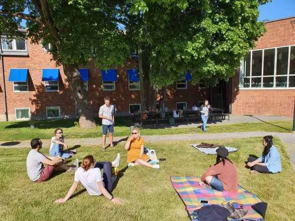 People at an outside picnic/BBQ.