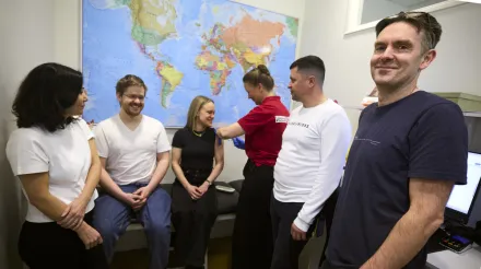 Gerald McInerney's research team gets a shot of their own vaccine.