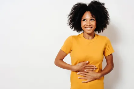 Woman with her hands on her stomach.