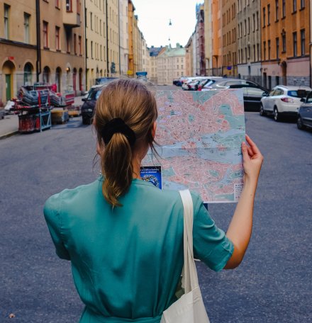 Student with map || Student with map. || Student holding map