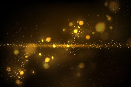 Splashes of golden rain with black background.