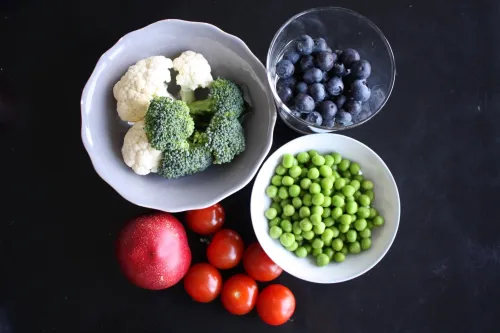 Bowls with fruit, berries and vegetables.